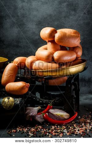 Closeup Pile Of Thick Wieners In Spiral With Onion And Chili