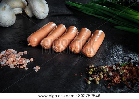 Small Row Of Long Sausages, Onion And Mushrooms