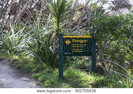 Golden Bay, New Zealand - 26 August, 2017: Sign At Wharariki Beach Warning Of Swimming Dangers. Whar