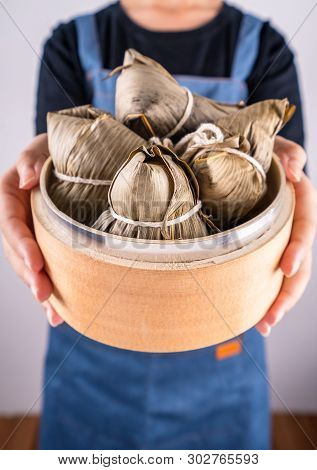 Zongzi, Delicious Steamed Rice Dumplings In Steamer In Black Background For Dragon Boat Duanwu Festi