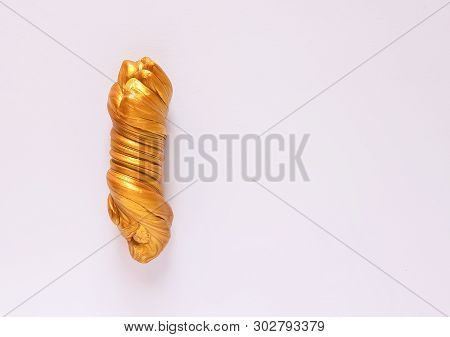 Golden Plasticine Soft Stretchable Texture. Anti-stress Toy For Kids Activities, Handmade, Fun.