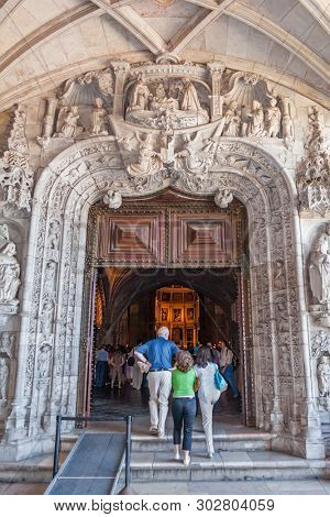 Lisbon, Portugal - June 30, 2018: West Portal of the Jeronimos Monastery or Abbey aka Santa Maria de Belem. UNESCO World Heritage Site. Manuelino or Manueline art.