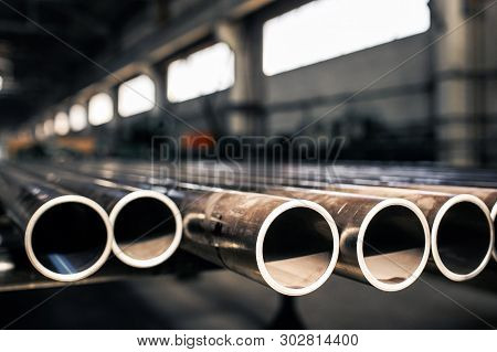 Metalic Pipes On Warehouse, Rows Of Metal Pipes On Industrial Warehouse. Industrial Interior,