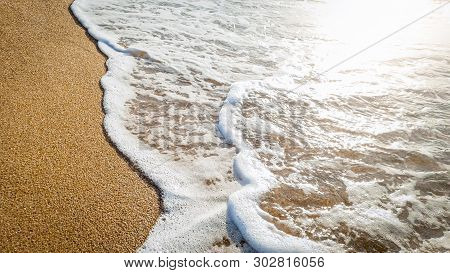 Closeup Image Of Calm Beautiful Sea Waves Rooling On The Sand At Beach. Landscape Of Ocean Shore At 