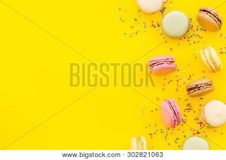 Brignt Macarons For Sweet Break On Yellow Background Top View Mock Up