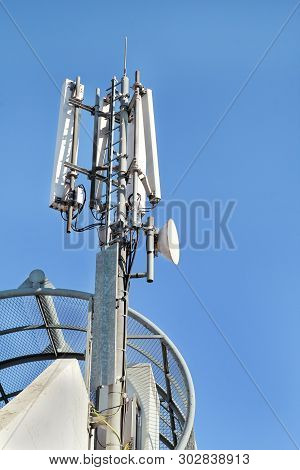 Telecommunication Base Stations Network Repeaters. The Cellular Communication Aerial On A Building. 