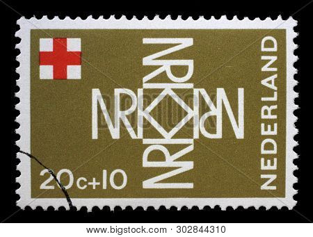ZAGREB, CROATIA - JULY 03, 2014: A stamp printed in Netherlands shows NRK (Nederlandse Rode Kruis) forming a cross, Red Cross series, circa 1967.
