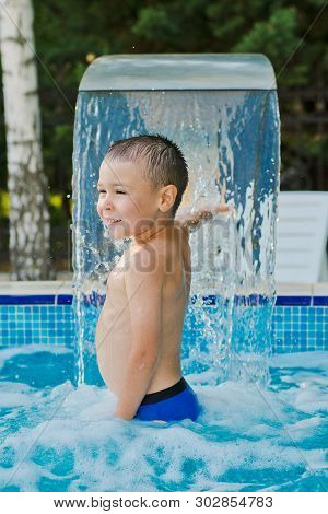 Child Sports In A Childrens Outdoor Pool