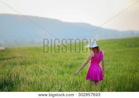 Beautiful Young Woman Standing Back Countryside, Rustick Nature Place In Green Field With Blue Sky C