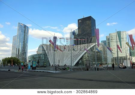 Paris, France - August 18, 2018:  People And Skyscrapers In La Defense Business Distrinct And The Su