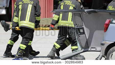 Rome, Rm, Italy - May 16, 2019: Firemen Stretcher Bearer And A Wounded Person After Road Accident