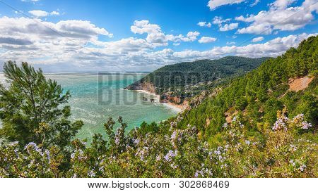 Picturesque Islets Faraglioni Di Puglia In Summer Adriatic Sea Bay Baia Delle Zagare. Mattinata Fara