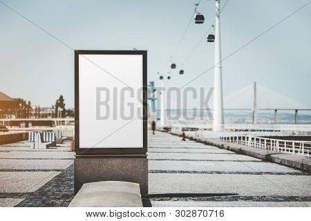 A Street Advert Banner Mockup On The Quayside; An Empty Ad Poster Template In Urban Settings With Ca