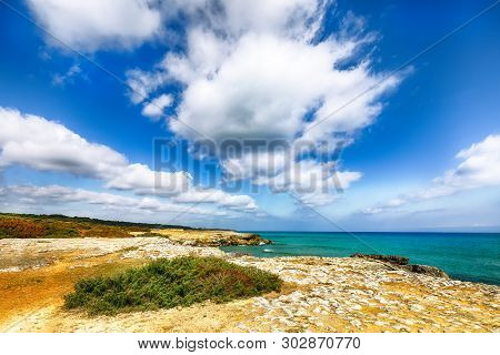 Picturesque Seascape With White Rocky Cliffs, Sea Bay, Islets And Faraglioni Near By Conca Specchiul