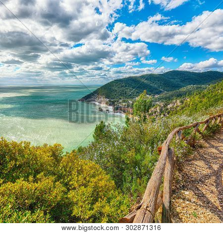 Picturesque Islets Faraglioni Di Puglia In Summer Adriatic Sea Bay Baia Delle Zagare. Mattinata Fara