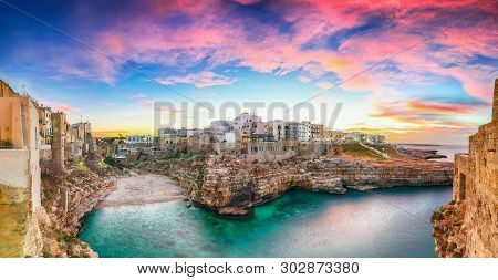 Sunset At Cala Paura Gulf With Bastione Di Santo Stefano And Lama Monachile Beach In Background. Pol