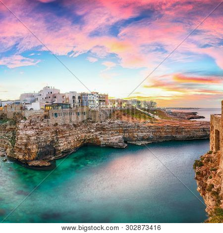 Sunset At Cala Paura Gulf With Bastione Di Santo Stefano And Lama Monachile Beach In Background. Pol