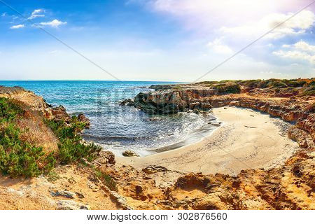 Picturesque Seascape With White Rocky Cliffs, Sea Bay, Islets And Faraglioni Near By Conca Specchiul