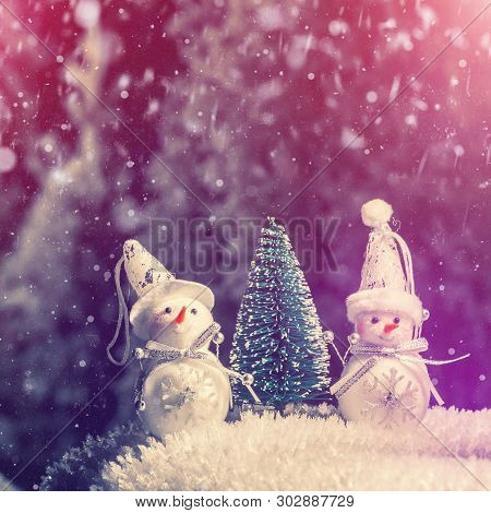 Winter Scenery. Christmas Snowmans And Christmas Tree On Natural Snow In Holiday Evening. Winter Sno