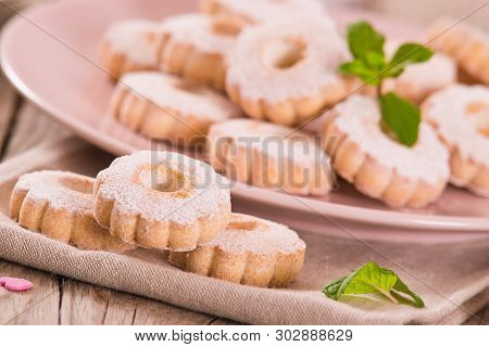 Canestrelli Biscuits With Mint On White Dish.