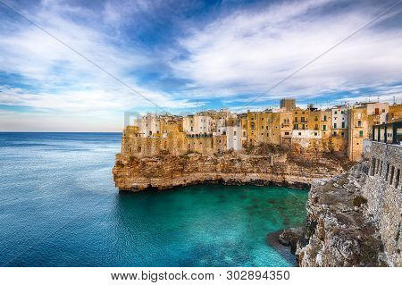 Polignano A Mare Village On The Rocks At Sunset. Polignano A Mare, Apulia, Italy, Province Of Bari.