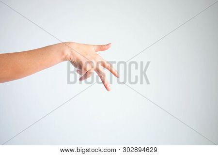 A Hand Showing Thumb, Forefinger And Middle Finger To Look Like Shape Of Man Walking; Or Like A Hand