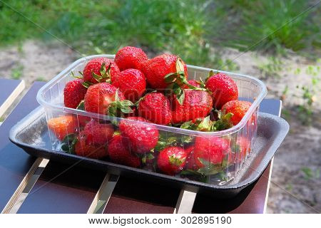 Fresh Tasty Strawberry In Boxes On Market. Helpful Berries With Lots Of Vitamins And Microelements. 