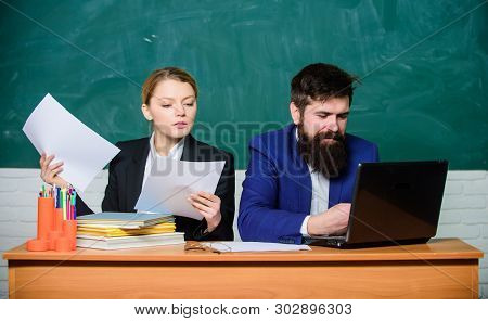Documenting The Result. Business Couple Use Laptop Document. Businessman And Secretary. Paper Work. 