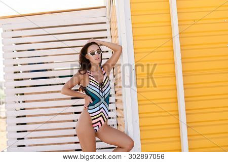 Sexy Blond Woman In Bikini Is Looking Over The Shoulder At Copy Space Three Quarter Length Studio Sh