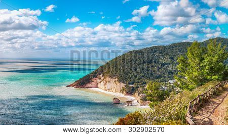 Picturesque Islets Faraglioni Di Puglia In Summer Adriatic Sea Bay Baia Delle Zagare. Mattinata Fara