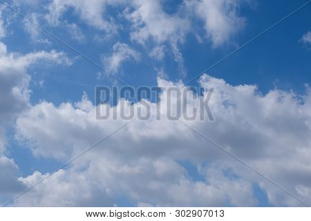 Beautiful Bright Blue Sky With White Fluffy Clouds On A Clear Sunny Day. Royalty High-quality Free S
