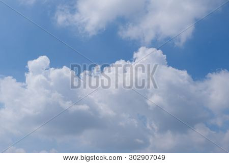 Beautiful Bright Blue Sky With White Fluffy Clouds On A Clear Sunny Day. Royalty High-quality Free S