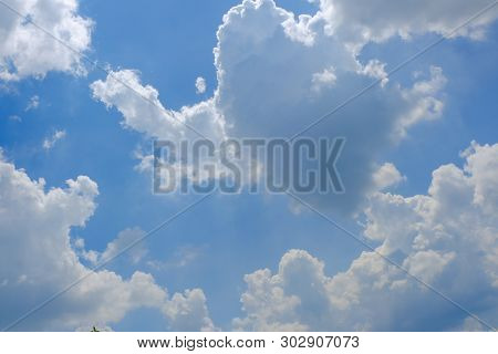 Beautiful Bright Blue Sky With White Fluffy Clouds On A Clear Sunny Day. Royalty High-quality Free S