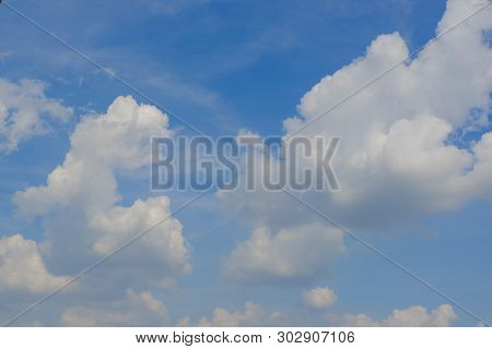 Beautiful Bright Blue Sky With White Fluffy Clouds On A Clear Sunny Day. Royalty High-quality Free S