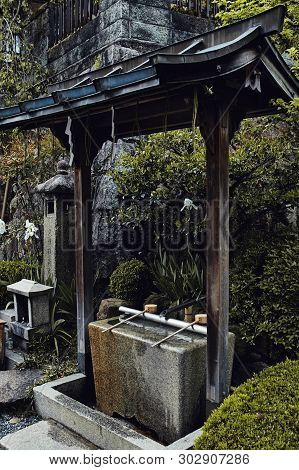 Traditional Japanese Details And Fountain At The Fushimi Inari-taisha Shrine In Kyoto, Japan