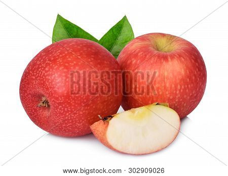 Two Whole And Half Pink Lady Apple With Green Leaf Isolated On White Background