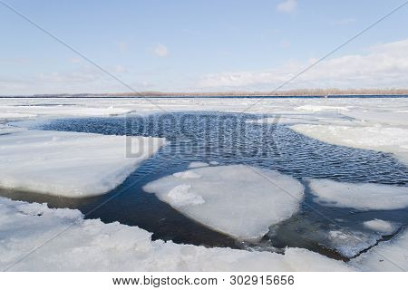 Spring Ice Drifting On The River. Background Texture.