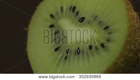 Fresh Kiwi Piece On A Dark Background.