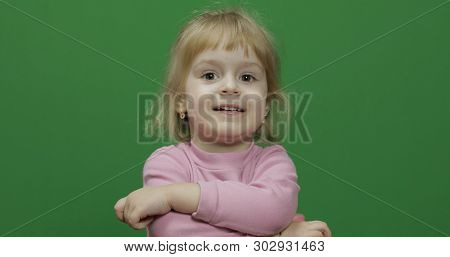 Happy Three Years Old Child. Cute Girl Smiling And Making Faces. Chroma Key. Brown Eyes. Green Scree