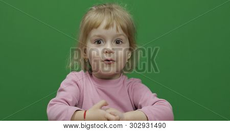 Happy Three Years Old Child. Cute Girl Making Faces. Chroma Key. Brown Eyes. Green Screen. Chroma Ke