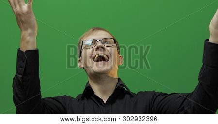 Portrait Of Attractive Happy Young Man Celebrate. Green Screen. Chroma Key