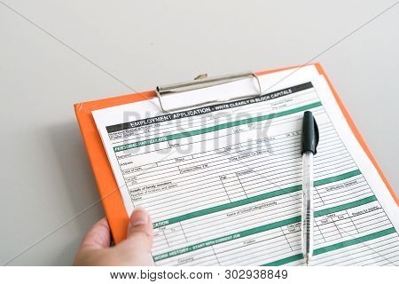 Seeking Job Concept, Filling Up The Information In An Employment Application Form