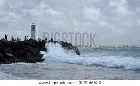 Buddina, Australia - Apr 21, 2019. People Relaxing On Buddina Beach Breakwall (sunshine Coast, Queen