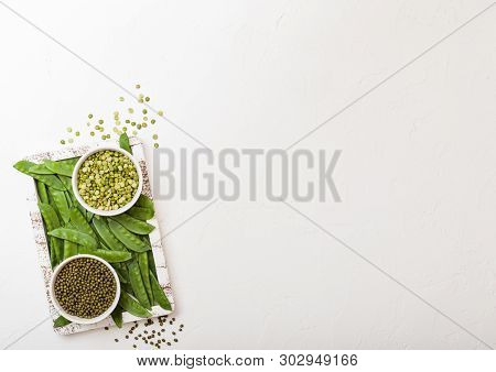 Bowl Of  Mung Beans And Split Peaswith Raw Organic Mangetout In Vintage Wooden Box On White Kitchen 