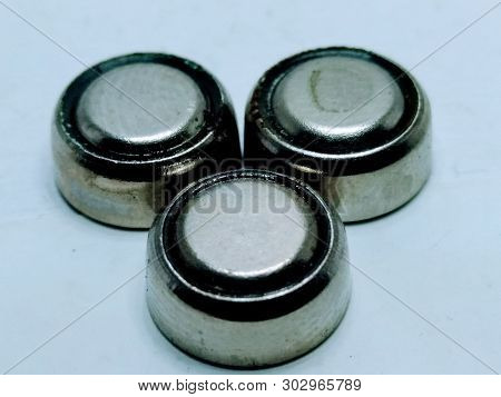 A Picture Of Round Battery On White Background