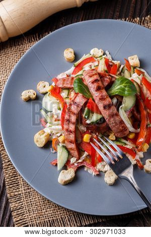 Salad With Grilled Sausage Paprica Cucumber And Croutons