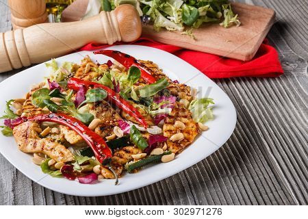 Mexican Salad With Hot Pepper Chiken Fillet Lettuce On Plate
