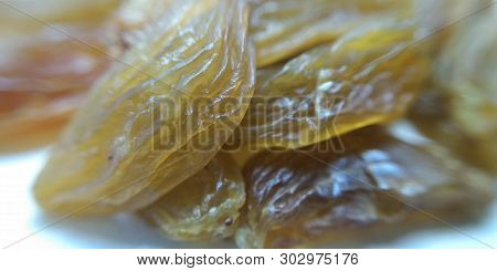 A Picture Of Dry Grapes On White Background