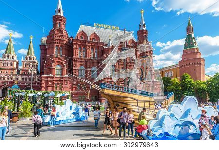 Moscow - May 19, 2019: People Walk On Manezhnaya Square By Moscow Kremlin, Russia. This Place Is A T