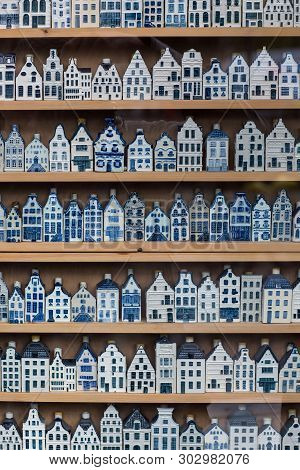 Traditional Souvenirs From Amsterdam Rows Of Delftware Porcelain Dutch Style Houses. Shop Display